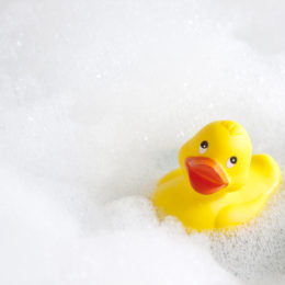 Yellow duck in a bath